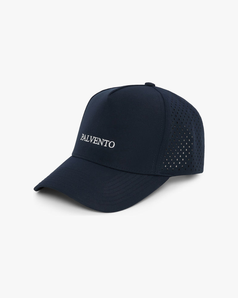 The Dunlin navy performance golf cap by Palvento, angled view