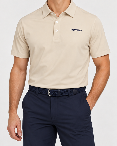 Palvento Ashridge stone performance polo worn with navy golf trousers and a navy woven belt.