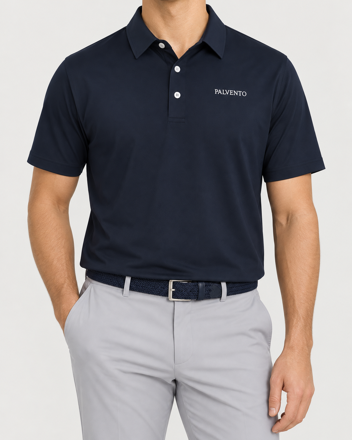 Palvento Harrington navy performance polo worn with light grey golf trousers and a navy woven belt.
