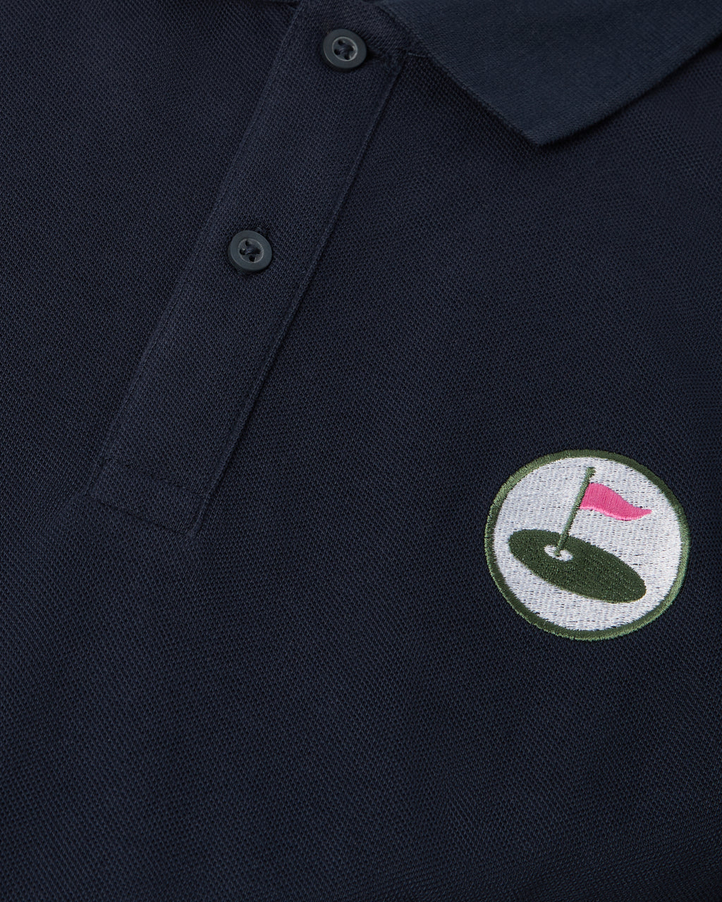 navy polo front with Palvento logo up close