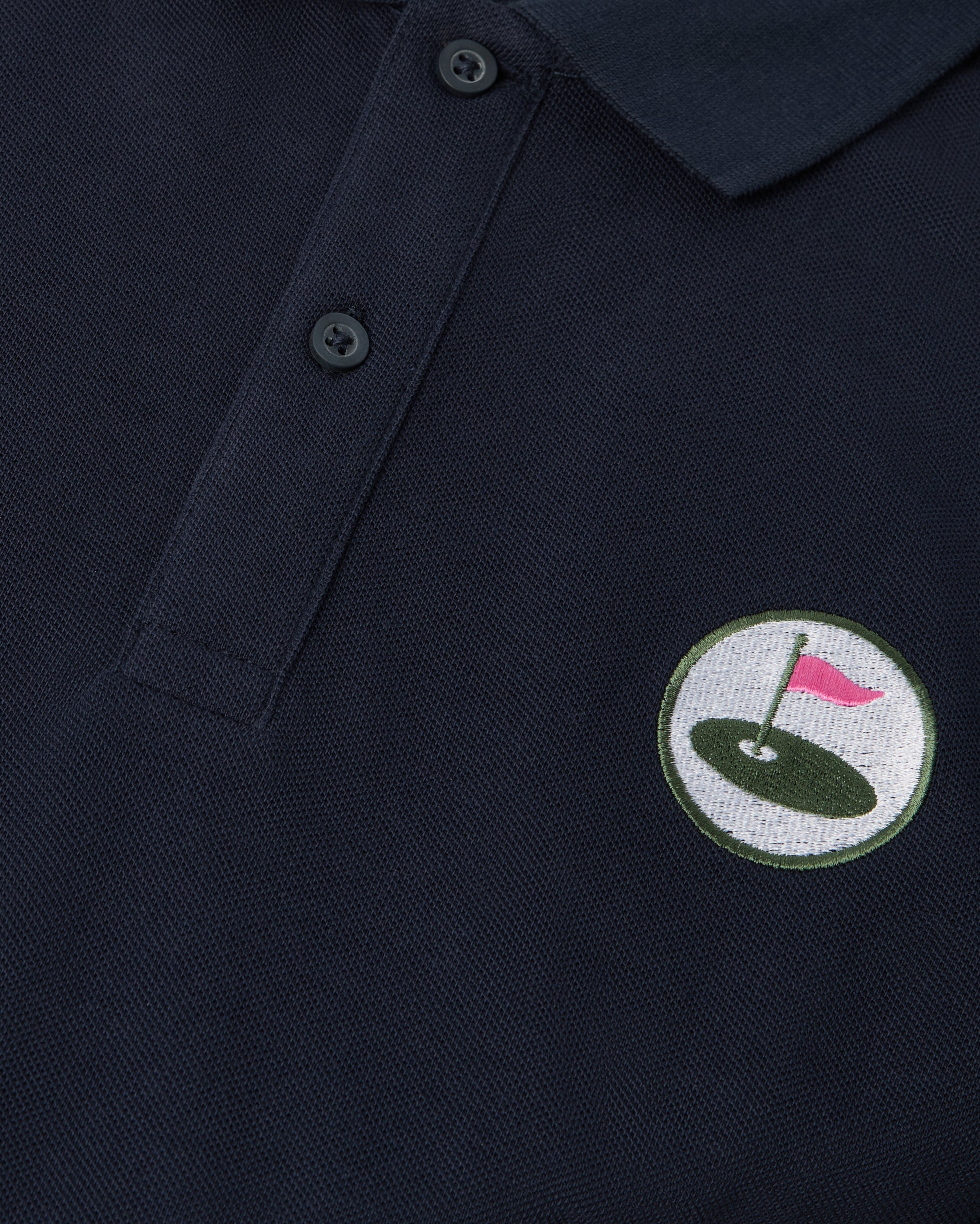 navy polo front with Palvento logo up close
