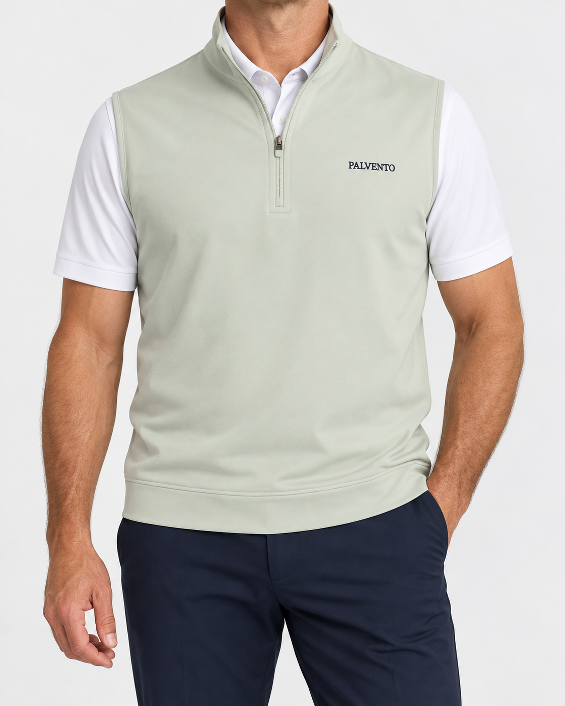 Model wearing the Carrick quarter-zip performance vest over a white Kingsley polo with navy trousers.