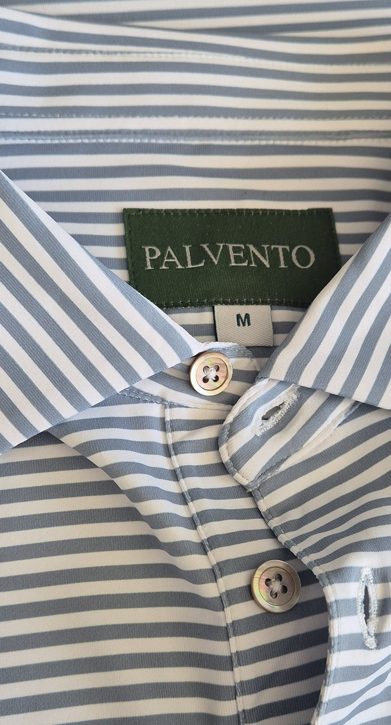 Close-up of the Palvento woven hem label on the Langford Heritage golf polo, showing the premium fabric and understated detailing.