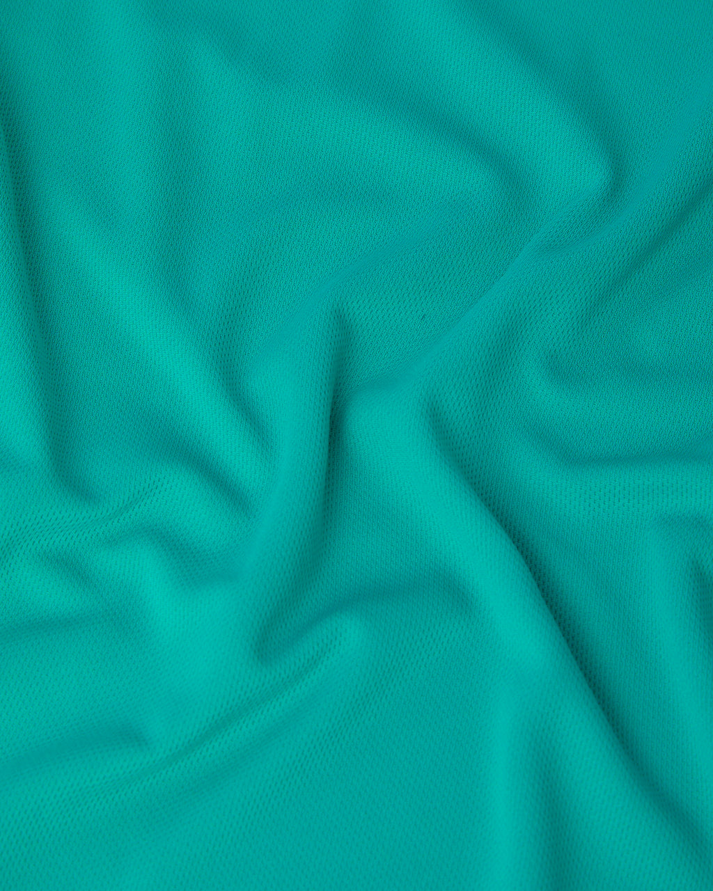 Close-up of turquise fabric with folds