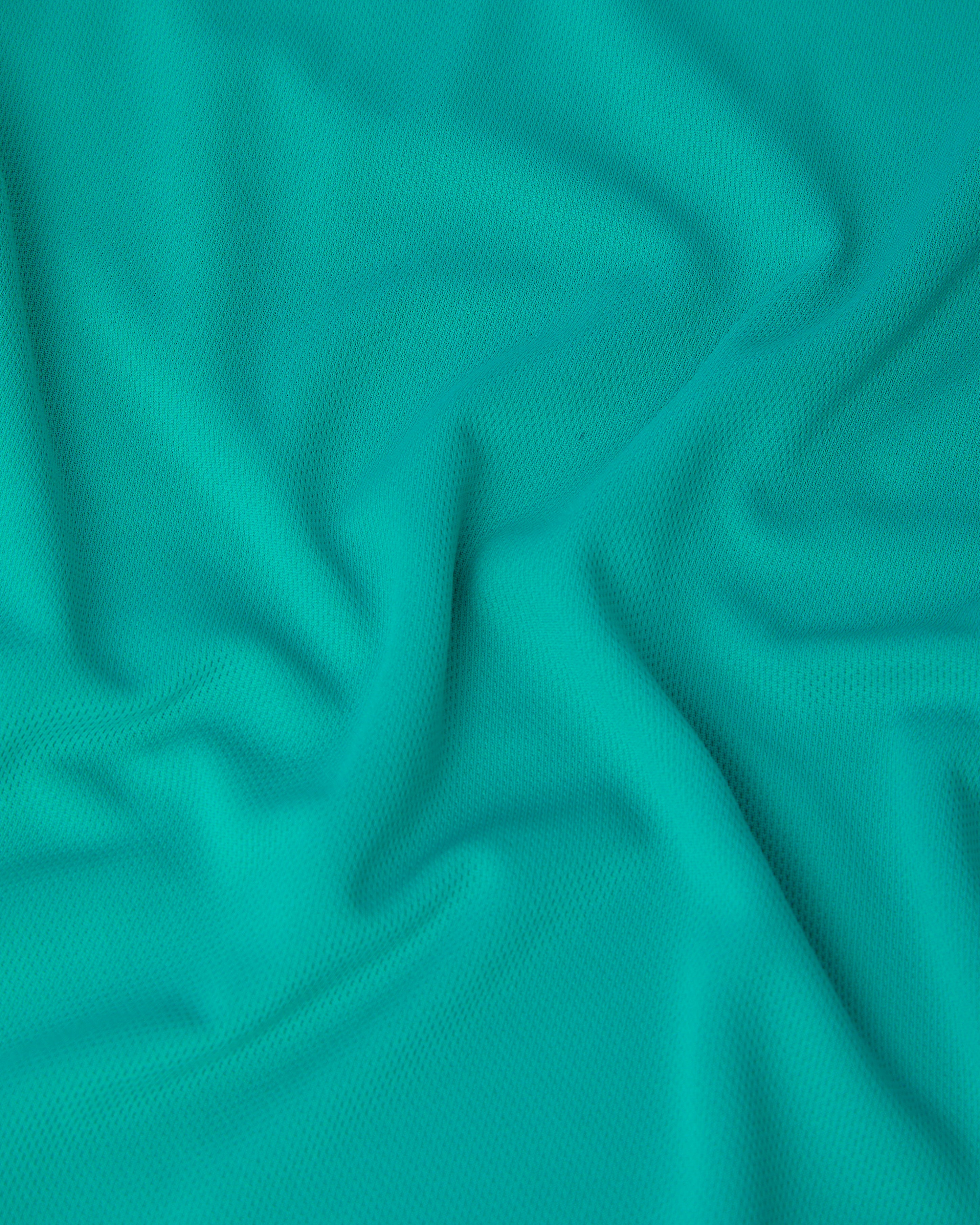 Close-up of turquise fabric with folds